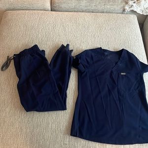 Navy blue Fig scrubs for sale.
